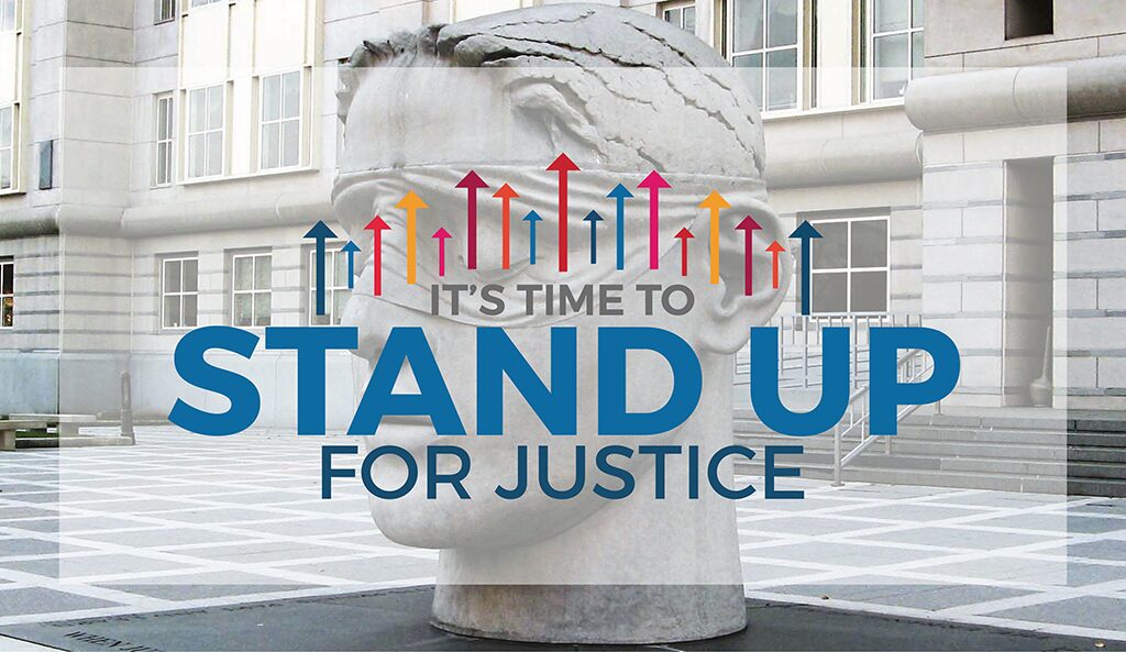 "It's Time to Stand Up for Justice" is over a photo of the lifesized statue of the "Lady Liberty's" head. There are arrows pointing up above the text in the SDG16 colors. 