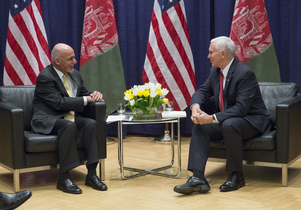 Afghan man and American man having a cheerful conversation