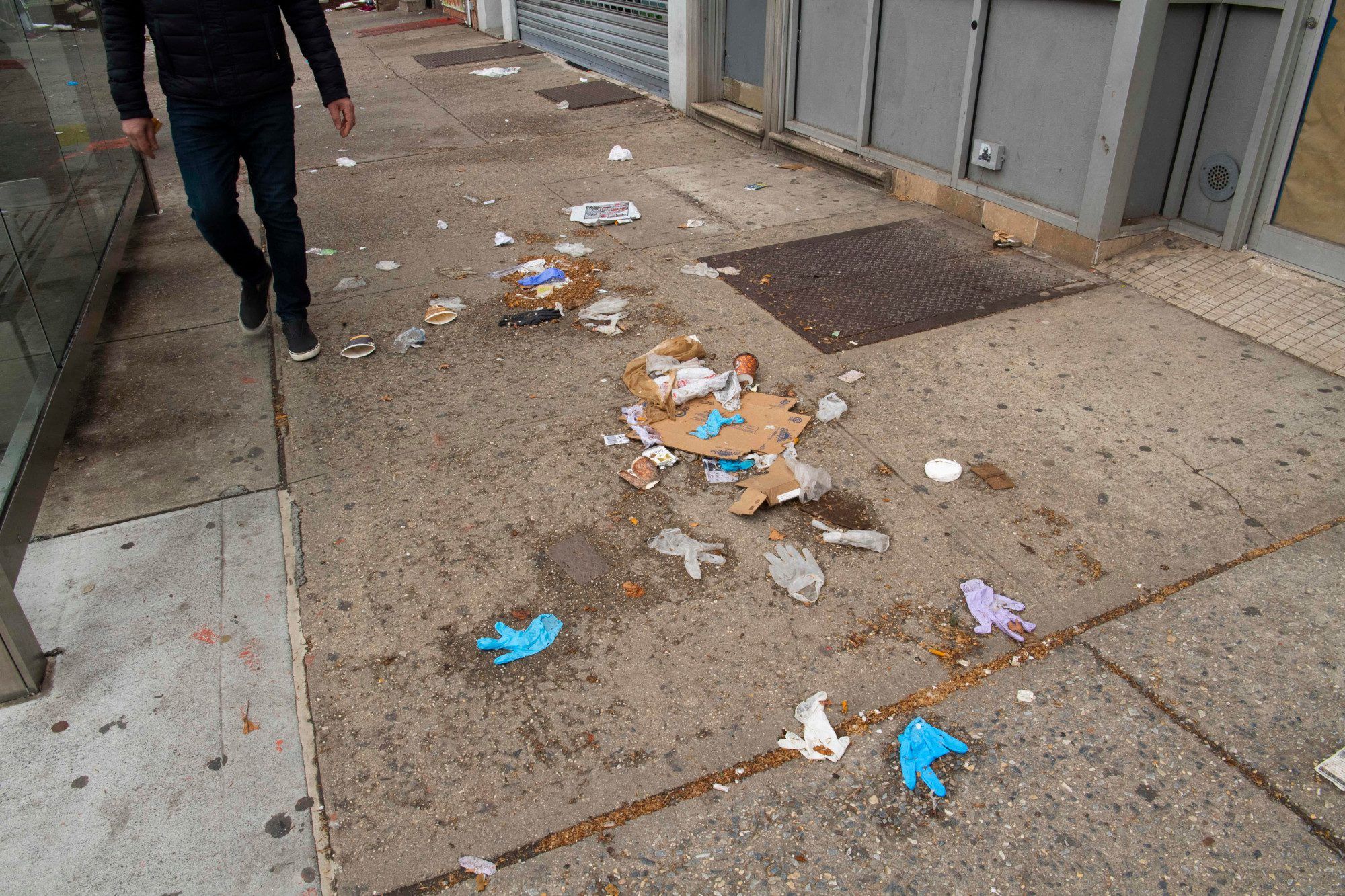 Sidewalk littered with trash