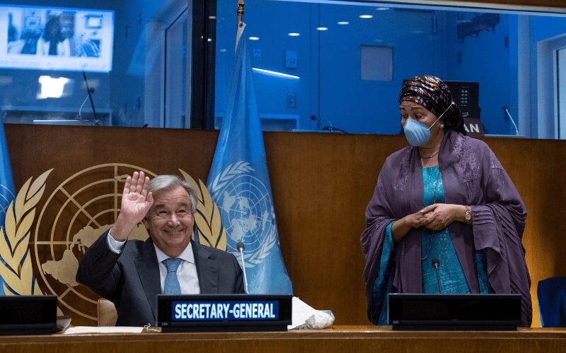 Secretary-General smiling and waving