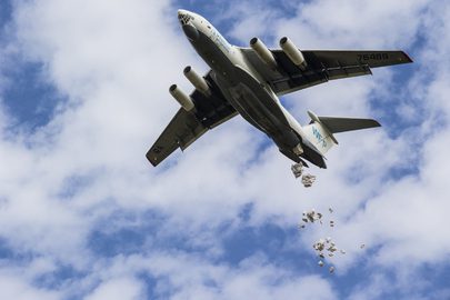 Airplane dropping packages from the air