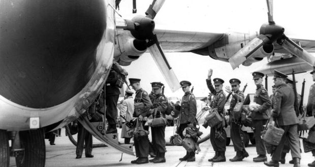 Antique photo of military men boarding plane