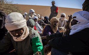 Crowd of Middle Eastern men holding guns