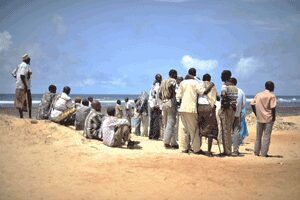 African men gathered near the shore