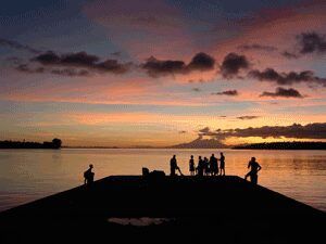 Silhouette of a group watching the sun set