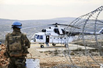 Solider outside helicopter