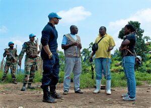 MONUSCO Human Rights Officer discusses with members of a Joint Protection Team including Civil Affairs, Child Protection and UNPOL in Mpati, North Kivu, Democratic Republic of the Congo.