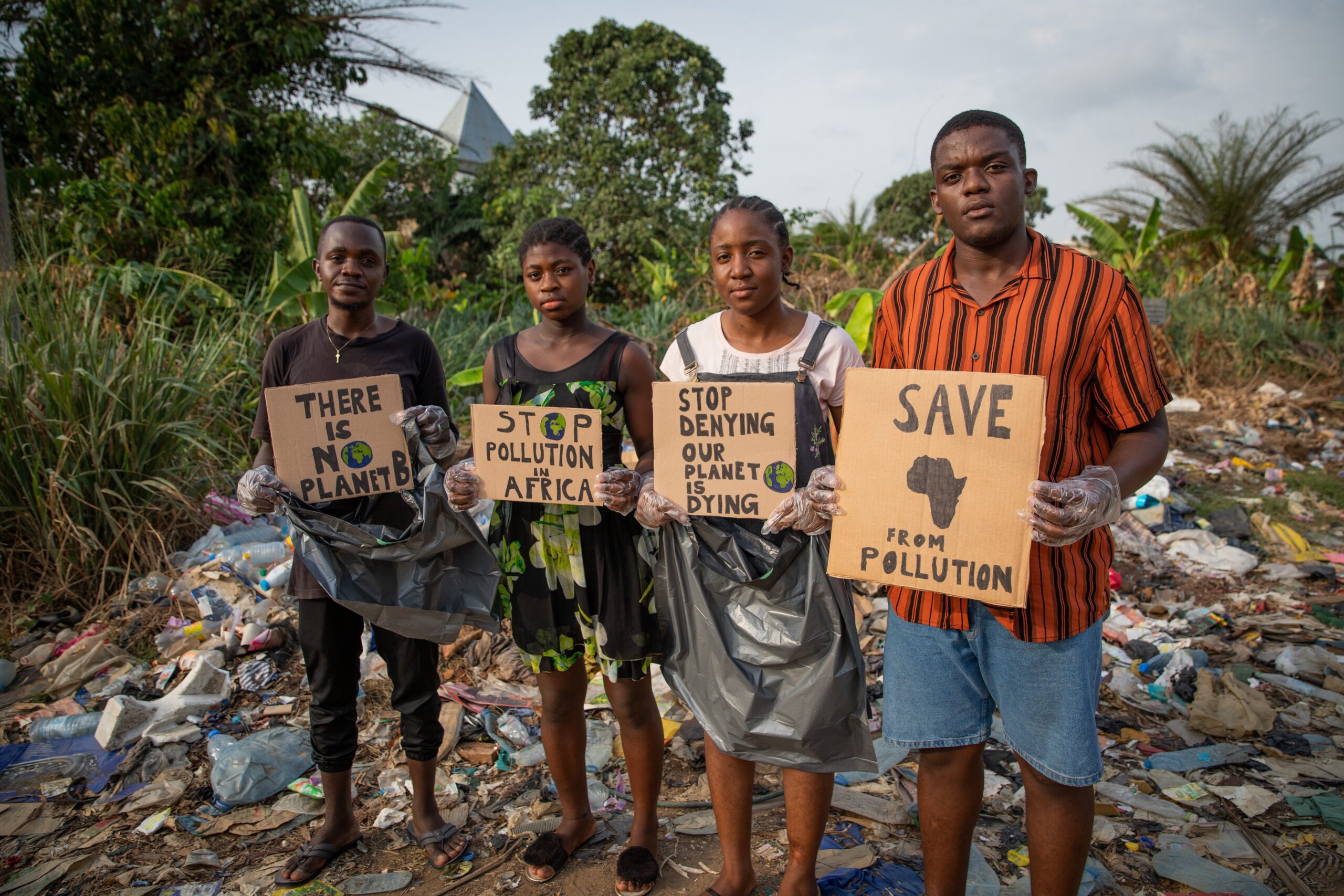 A group of young African activists protesting pollution