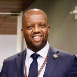 Headshot of H.E. Ambassador Martin Kimani.