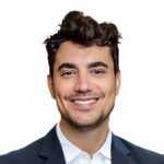 Headshot of a person with short brown hair in a suit.