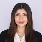 Headshot of Yasmin Rammal in front of white wall.
