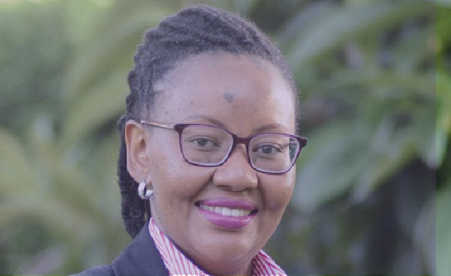 Headshot of a person with glasses with purple fade over the photo