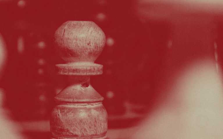 Red gradient over a large chess piece.