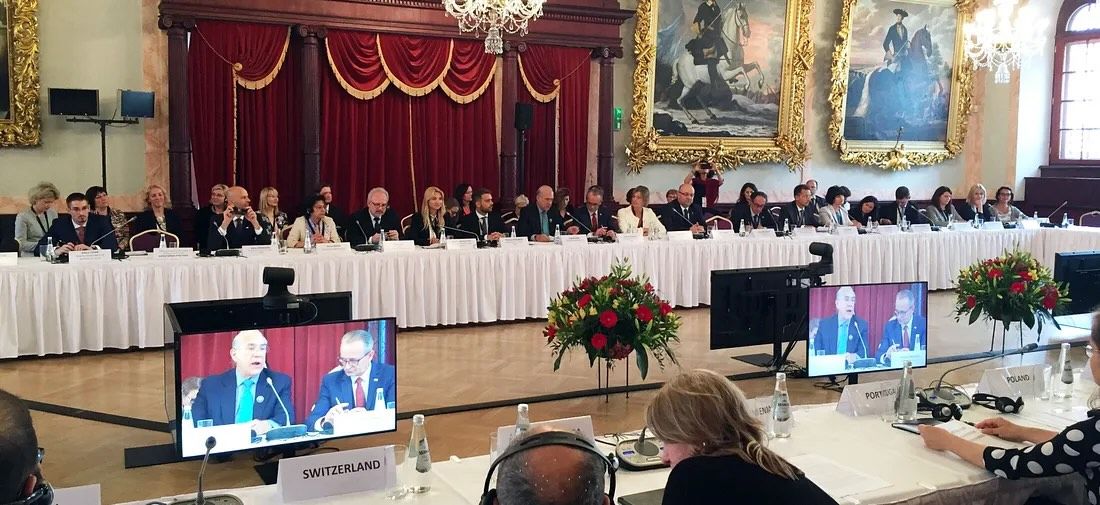 Row of speakers seated at the event.