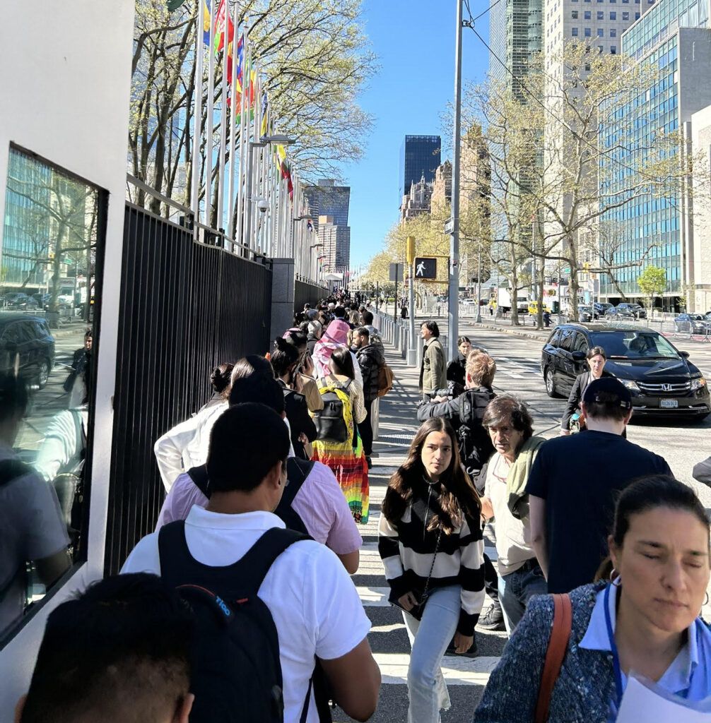 Line of youth waiting to get inside the United Nations Headquarters building in New York.