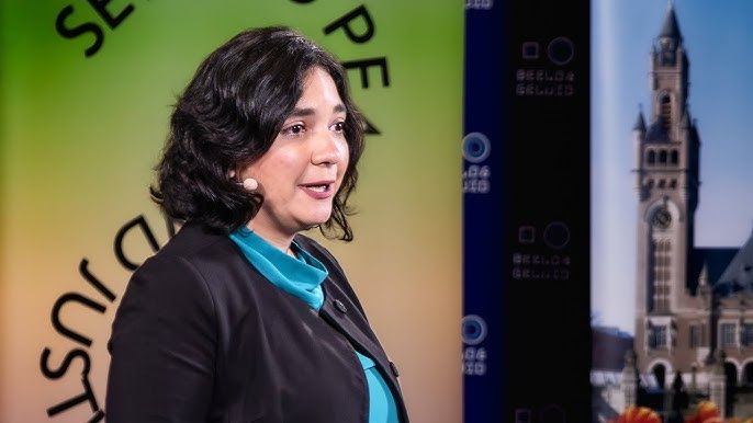 Headshot of a person speaking with a headset mic at Hague Talks 2022.