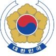 Logo of a 5 point yellow flower with the south korean flag circle (red and blue) as the center. Korean letters are below flower.