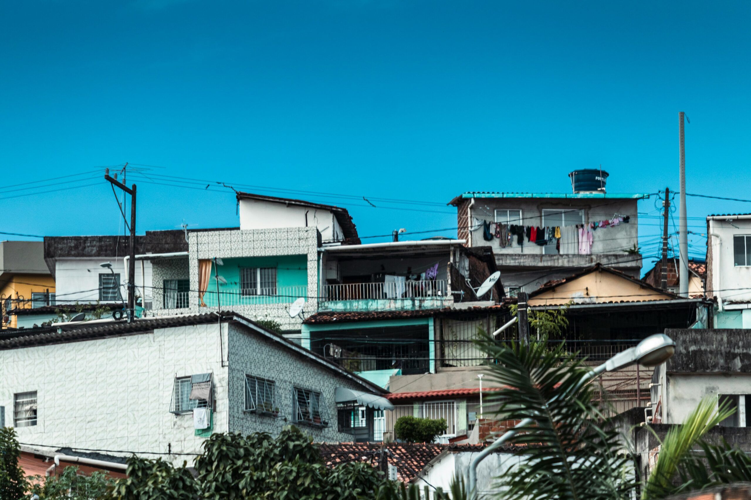 A group of buildings with trees in front of them.